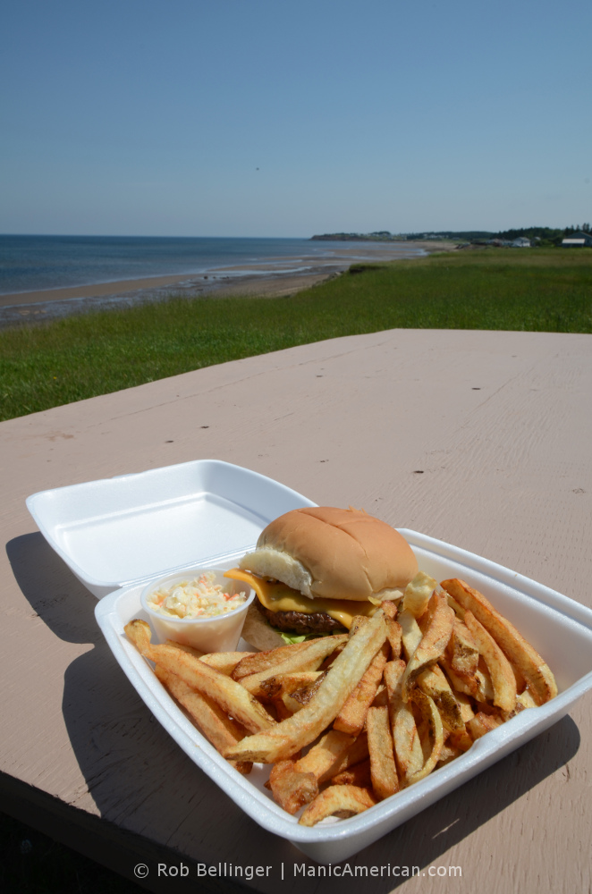 burger platter on beachside picnic table